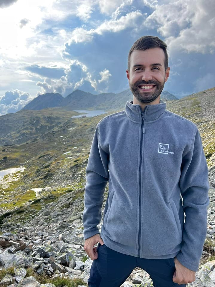 smilin man with branded Flat Rock hoodie